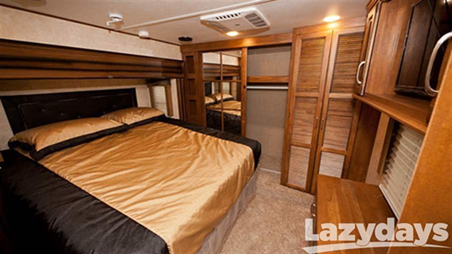 A master bedrooom is included on all the floorplans of the 2016 Keystone RV Raptor Toy Hauler models. 